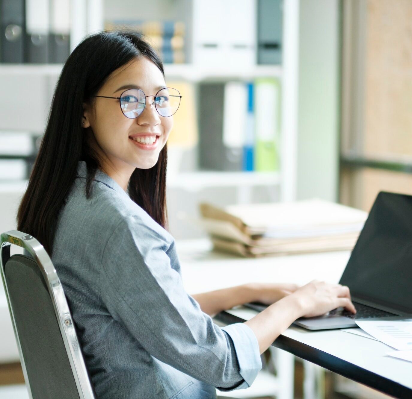 Young asian business woman or student working online on computer laptop.